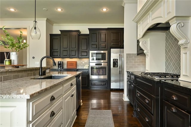 15601 Windsor St, Overland Park, KS 66224 - kitchen featuring stainless steel appliances, a sink, tasteful backsplash, light stone countertops, and crown molding