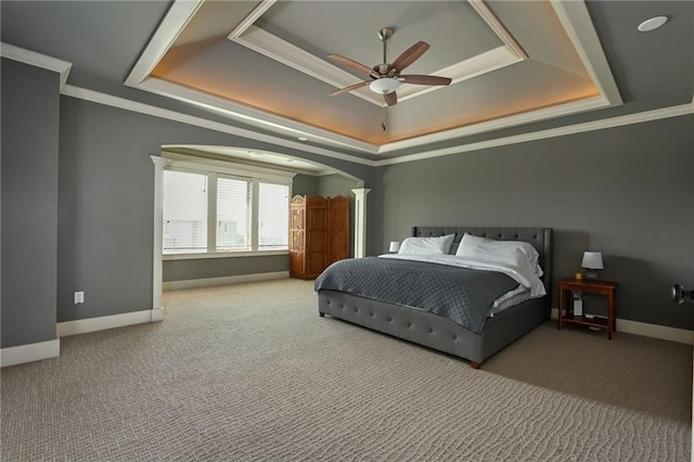 15601 Windsor St, Overland Park, KS 66224 - carpeted bedroom with a raised ceiling, ornate columns, arched walkways, baseboards, and crown molding