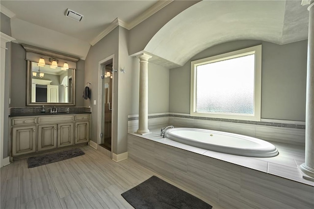 15601 Windsor St, Overland Park, KS 66224 - full bathroom with decorative columns, a garden tub, vanity, ornamental molding, and a shower stall