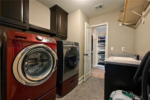 15601 Windsor St, Overland Park, KS 66224 - laundry area featuring cabinet space and washer and clothes dryer