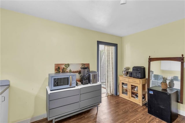 office featuring dark wood finished floors and baseboards