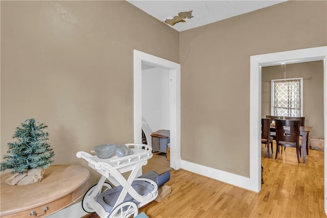interior space with light wood finished floors and baseboards