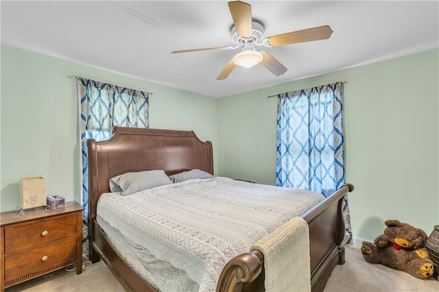 bedroom with light colored carpet and ceiling fan