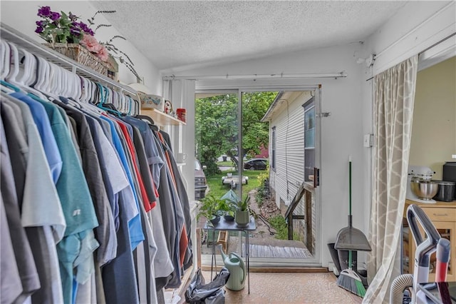 walk in closet featuring lofted ceiling