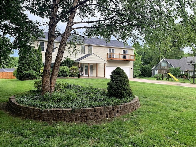 5239 Catalina St, Roeland Park, KS 66205 - view of front of property with driveway, a garage, and a front lawn