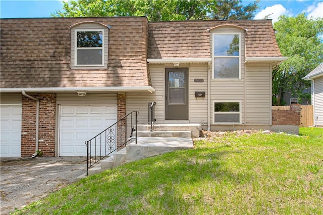 9406 Switzer St, Overland Park, KS 66214 - view of front of house with roof with shingles, mansard roof, a front yard, a garage, and driveway