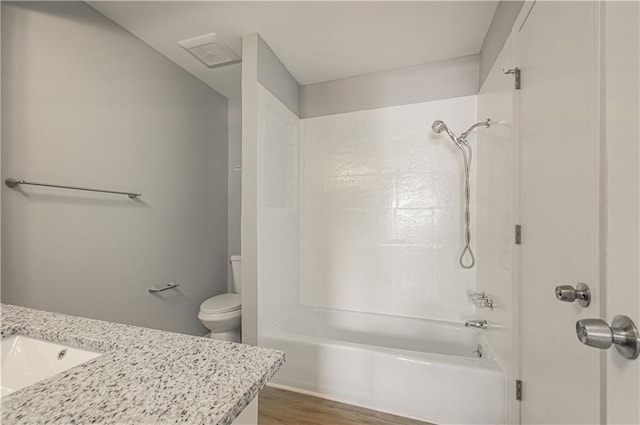 9406 Switzer St, Overland Park, KS 66214 - full bath featuring toilet, wood finished floors, tub / shower combination, and vanity