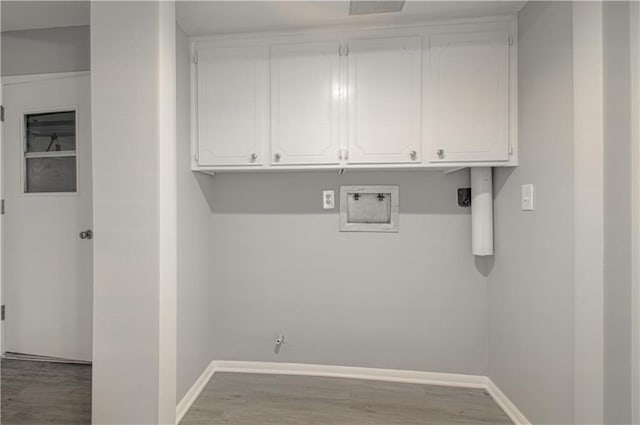 9406 Switzer St, Overland Park, KS 66214 - washroom featuring baseboards, hookup for a washing machine, and wood finished floors