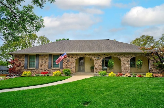 1014 SW Twilight Ln, Blue Springs, MO 64015 - view of front of property featuring a front yard, brick siding, and roof with shingles