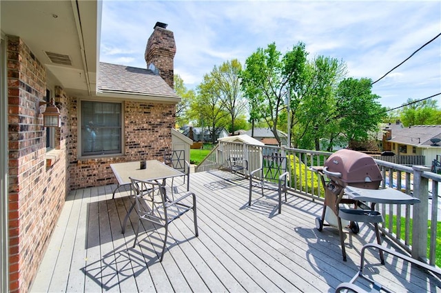 1014 SW Twilight Ln, Blue Springs, MO 64015 - deck featuring a grill and outdoor dining space