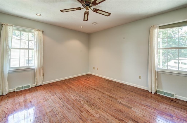 1014 SW Twilight Ln, Blue Springs, MO 64015 - unfurnished room featuring wood finished floors, a ceiling fan, and recessed lighting