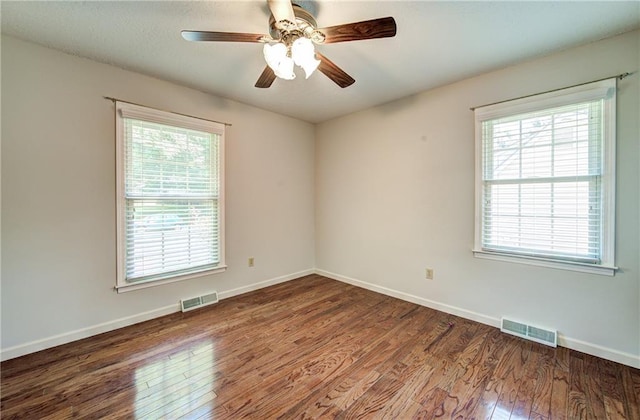 1014 SW Twilight Ln, Blue Springs, MO 64015 - unfurnished room featuring wood finished floors, healthy amount of natural light, and a ceiling fan