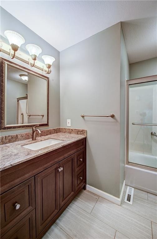 1014 SW Twilight Ln, Blue Springs, MO 64015 - full bathroom featuring vanity, enclosed tub / shower combo, and tile patterned flooring