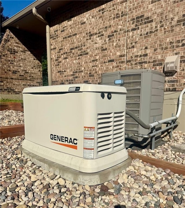 1014 SW Twilight Ln, Blue Springs, MO 64015 - exterior view of a power unit and brick siding