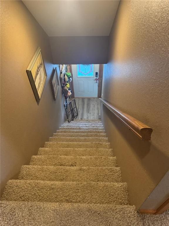 8000 County Road 43, Rosendale, MO 64483 - staircase with a textured wall and wood finished floors