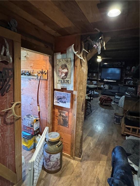 8000 County Road 43, Rosendale, MO 64483 - basement with hardwood / wood-style flooring and wooden walls