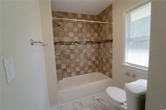 10203 Fremont Ave, Kansas City, MO 64134 - full bath featuring toilet, shower / tub combination, and marble look tile flooring