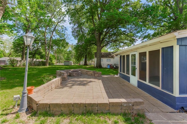 view of patio featuring a fire pit