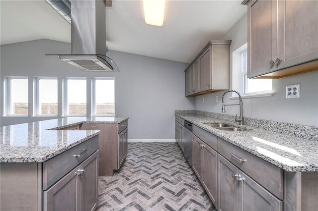 1086 SW 75 Th Rd, Holden, MO 64040 - kitchen with vaulted ceiling, stainless steel dishwasher, plenty of natural light, brick patterned flooring, and island exhaust hood