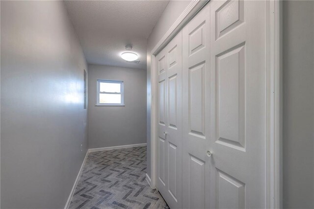 1086 SW 75 Th Rd, Holden, MO 64040 - corridor featuring tile patterned floors and a textured ceiling