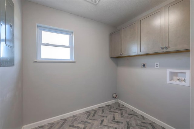1086 SW 75 Th Rd, Holden, MO 64040 - laundry room with cabinet space, hookup for an electric dryer, hookup for a washing machine, and a textured ceiling