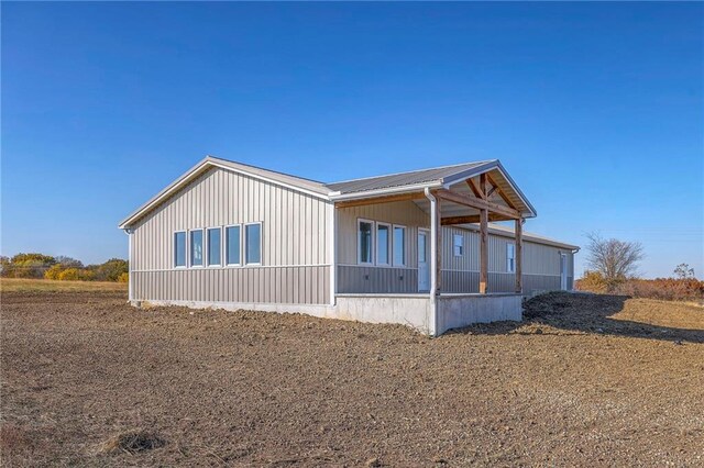 1086 SW 75 Th Rd, Holden, MO 64040 - view of home's exterior with a metal roof