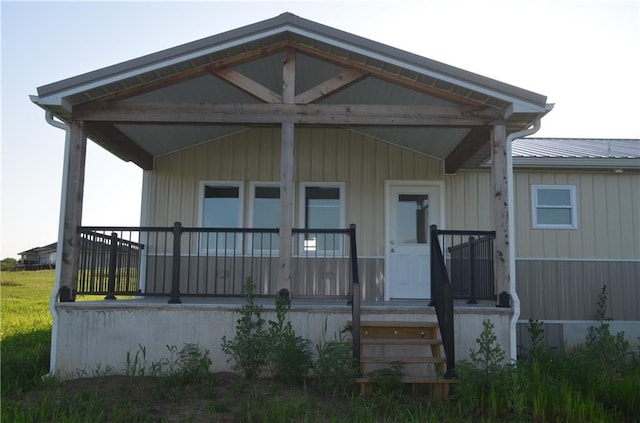 1086 SW 75 Th Rd, Holden, MO 64040 - back of house with covered porch and a metal roof