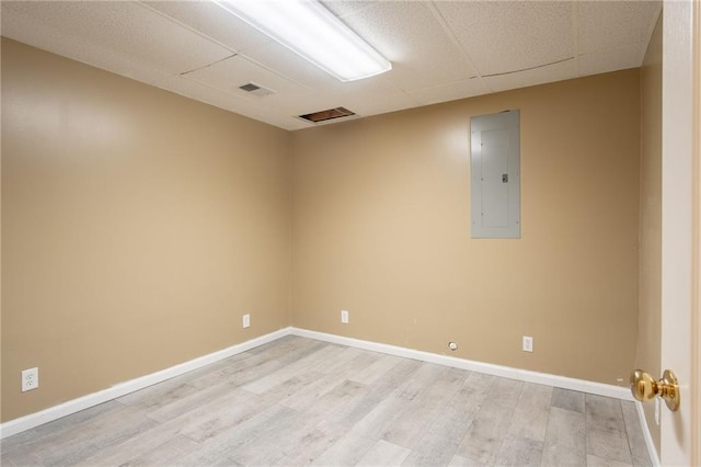 1703 Rolling Rock Rd, Raymore, MO 64083 - spare room with electric panel and light wood-style flooring