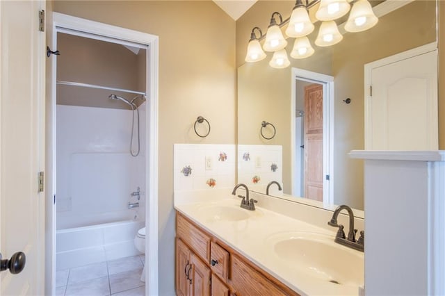 1703 Rolling Rock Rd, Raymore, MO 64083 - bathroom with double vanity, tub / shower combination, tile patterned flooring, and a chandelier