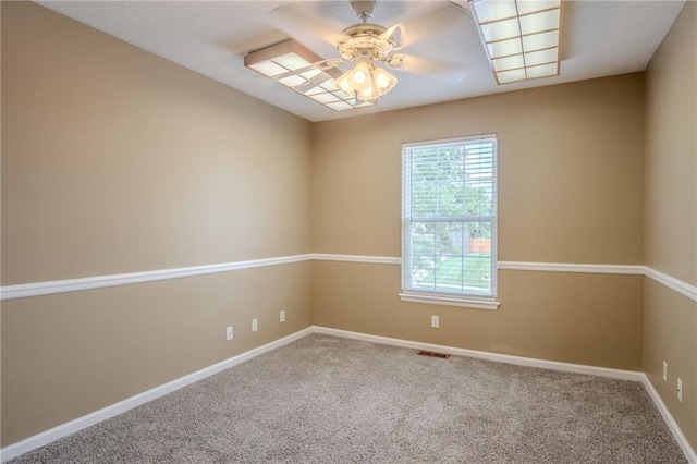 1703 Rolling Rock Rd, Raymore, MO 64083 - carpeted empty room featuring a ceiling fan and baseboards