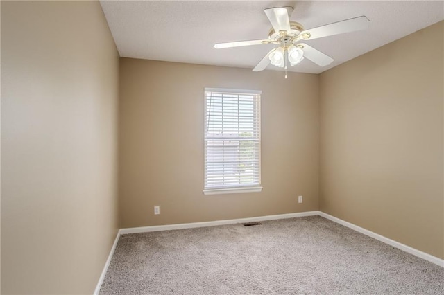 1703 Rolling Rock Rd, Raymore, MO 64083 - carpeted empty room with baseboards and ceiling fan