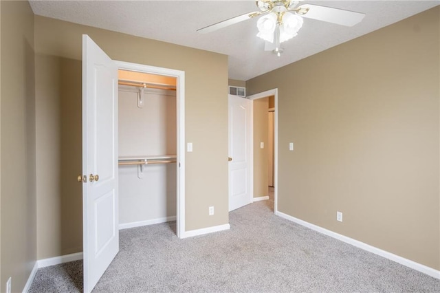 1703 Rolling Rock Rd, Raymore, MO 64083 - unfurnished bedroom with carpet flooring, a closet, and a ceiling fan