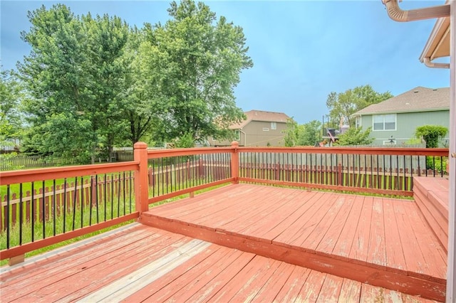 1703 Rolling Rock Rd, Raymore, MO 64083 - wooden deck with a fenced backyard