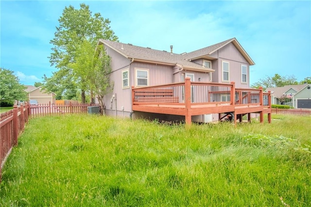 1703 Rolling Rock Rd, Raymore, MO 64083 - rear view of house featuring a wooden deck and a fenced backyard