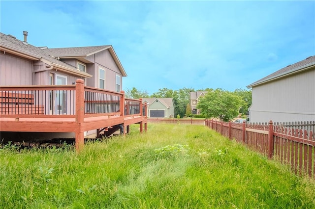 1703 Rolling Rock Rd, Raymore, MO 64083 - view of yard featuring a deck