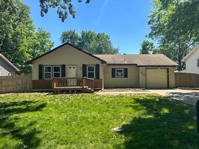 307 SW Glendana St, Lees Summit, MO 64081 - ranch-style house featuring a garage, driveway, and a wooden deck