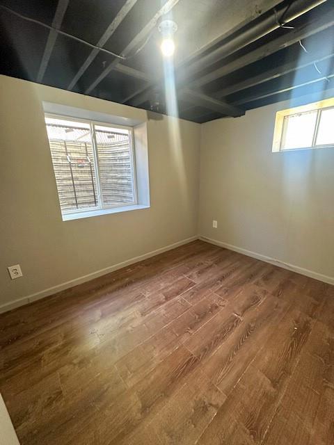 307 SW Glendana St, Lees Summit, MO 64081 - below grade area featuring wood finished floors and baseboards