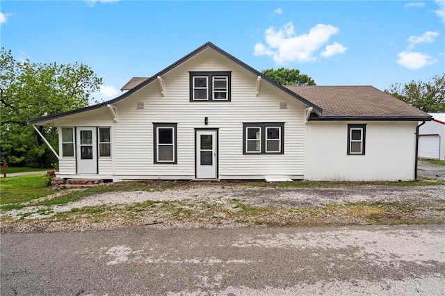 312 2nd St, Ferrelview, MO 64163 - view of front facade with roof with shingles
