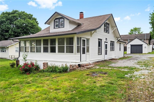 312 2nd St, Ferrelview, MO 64163 - view of side of home featuring a chimney, a yard, a sunroom, driveway, and roof with shingles