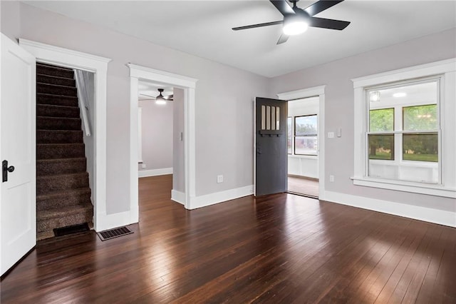 312 2nd St, Ferrelview, MO 64163 - unfurnished living room featuring a ceiling fan, wood-type flooring, stairway, and baseboards
