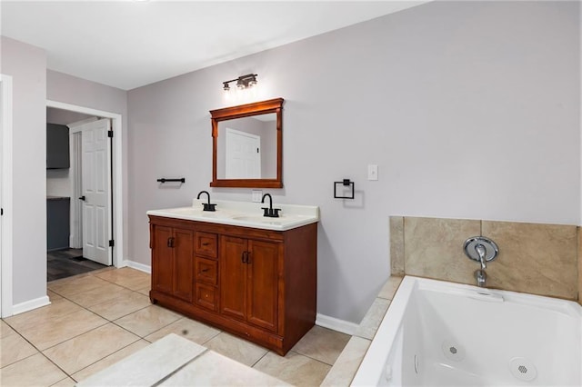 312 2nd St, Ferrelview, MO 64163 - bathroom featuring a whirlpool tub, tile patterned flooring, double vanity, and baseboards
