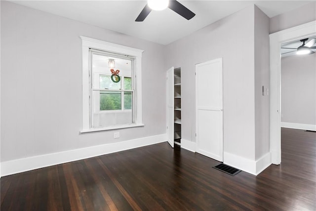 312 2nd St, Ferrelview, MO 64163 - unfurnished bedroom with wood finished floors, baseboards, and a ceiling fan