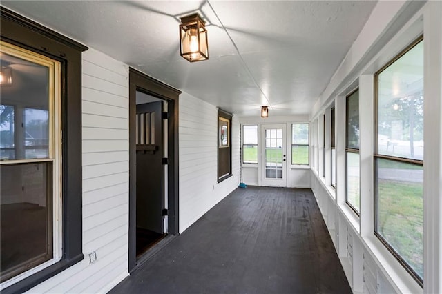 312 2nd St, Ferrelview, MO 64163 - unfurnished sunroom with wood walls