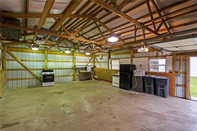 312 2nd St, Ferrelview, MO 64163 - garage with freestanding refrigerator