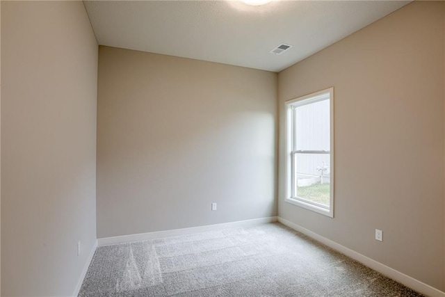 spare room with carpet flooring and baseboards