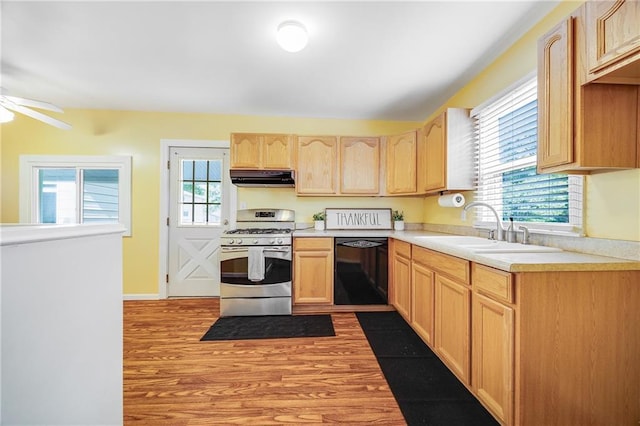 1503 S Spring St, Independence, MO 64055 - kitchen featuring stainless steel range with gas stovetop, dishwasher, ventilation hood, a sink, and light brown cabinets
