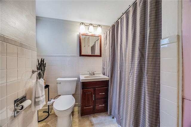 1503 S Spring St, Independence, MO 64055 - full bath featuring toilet, vanity, tile walls, a shower with shower curtain, and tile patterned flooring