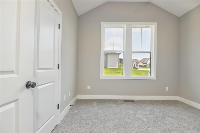 24105 W 58th Pl, Shawnee, KS 66226 - unfurnished room with light colored carpet, lofted ceiling, and baseboards