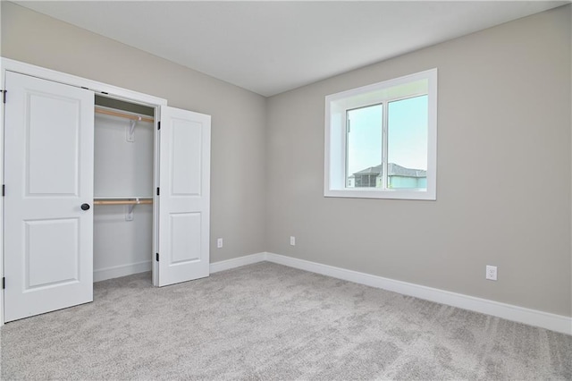 24105 W 58th Pl, Shawnee, KS 66226 - unfurnished bedroom featuring carpet, baseboards, and a closet