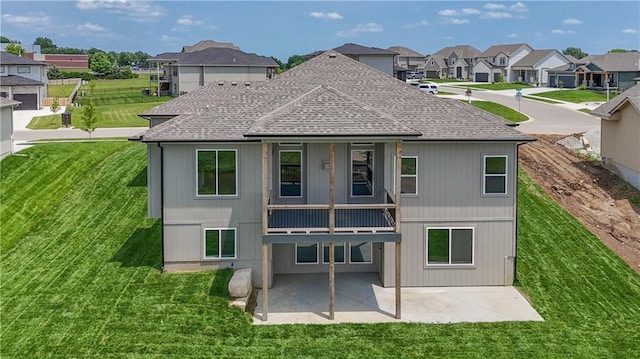 24105 W 58th Pl, Shawnee, KS 66226 - rear view of property with a shingled roof, a residential view, a patio area, a balcony, and a lawn